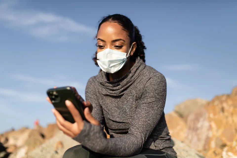A person checking health information on their phone
